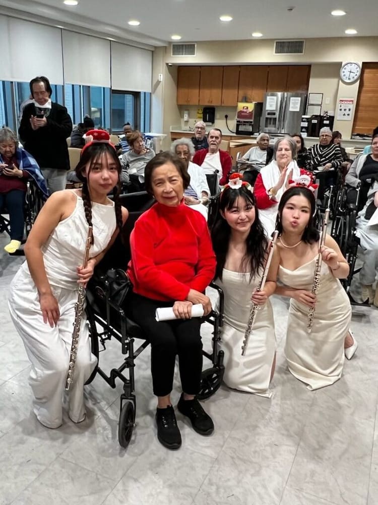 Monica and fellow flutists with audience members after a performance